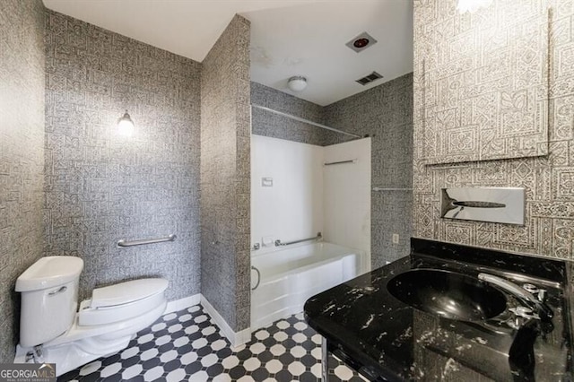 full bath with vanity, toilet, tub / shower combination, and visible vents