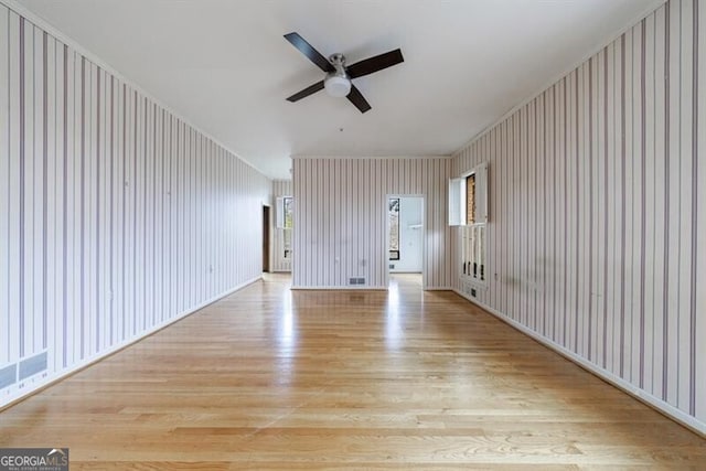 interior space featuring light wood-type flooring and ceiling fan