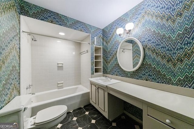 bathroom featuring tile patterned floors, shower / washtub combination, vanity, and toilet