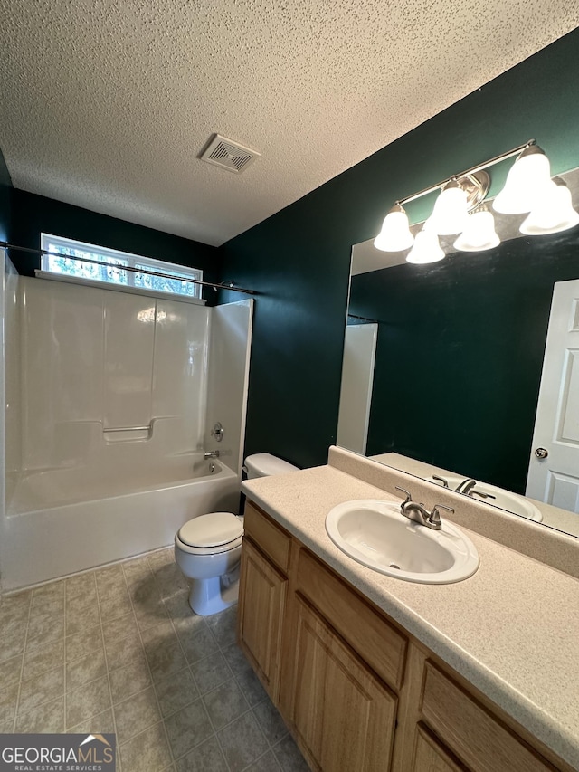 full bathroom featuring visible vents, toilet, vanity, a textured ceiling, and  shower combination