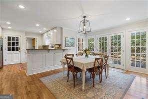 dining space with recessed lighting and wood finished floors