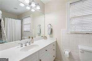 bathroom with a healthy amount of sunlight and vanity