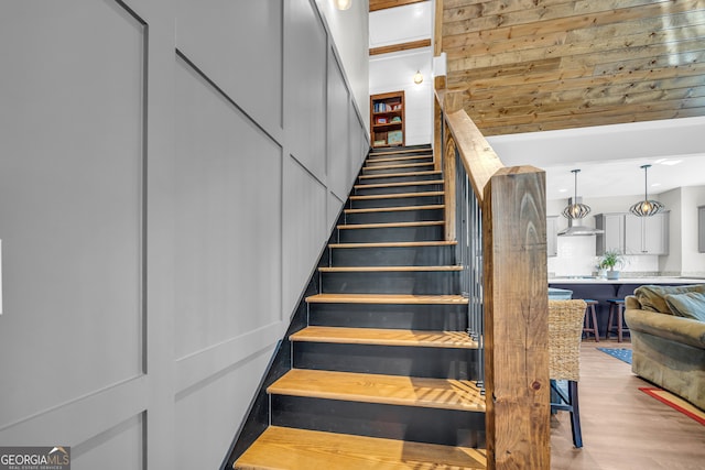 stairway featuring wood finished floors