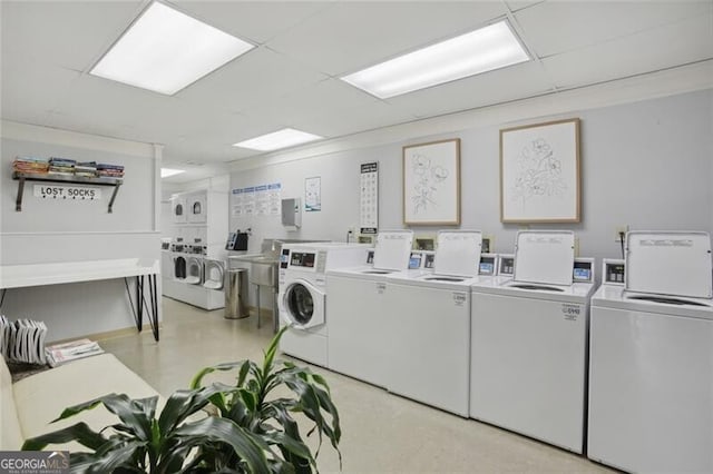 community laundry room with washer and dryer and stacked washer and clothes dryer