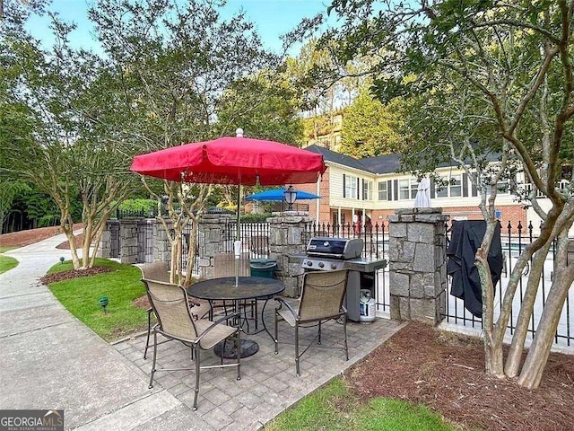 view of patio featuring fence