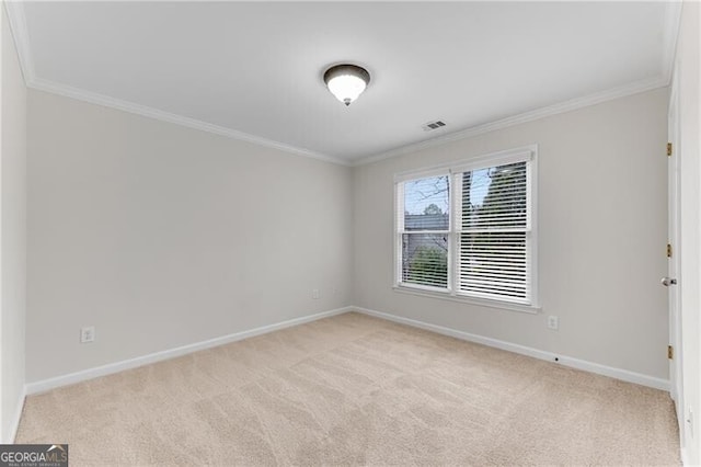 unfurnished room with visible vents, light colored carpet, and ornamental molding