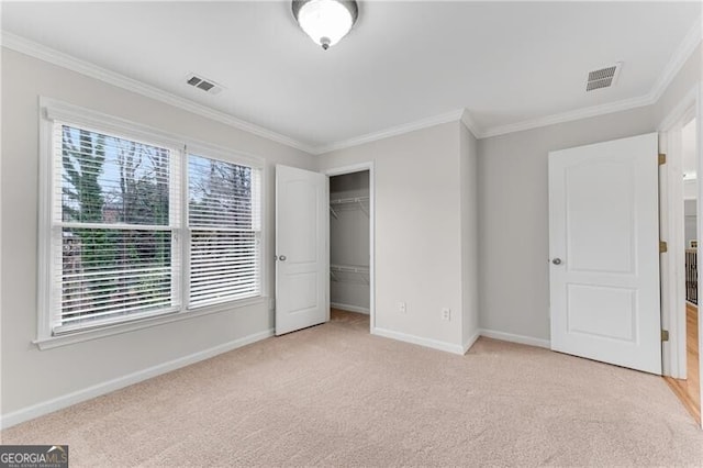 1900 Sanborne Way, Dacula, GA 30019 - unfurnished bedroom with crown molding, baseboards, light carpet, and a closet