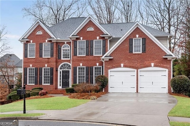 1900 Sanborne Way, Dacula, GA 30019 - colonial house featuring driveway, brick siding, a garage, and a front yard