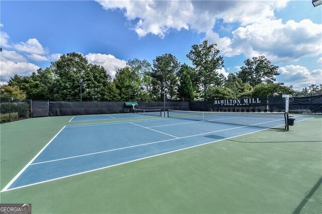 view of tennis court with fence