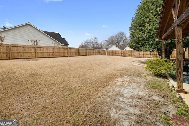 view of yard with a fenced backyard