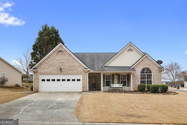 view of front of property with driveway, a shingled roof, a front lawn, a garage, and brick siding