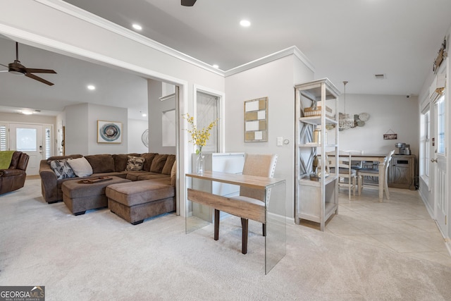 living room featuring a ceiling fan, recessed lighting, light colored carpet, and ornamental molding