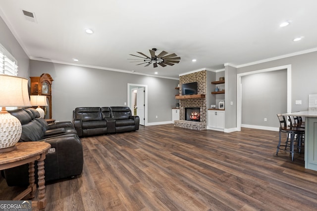 living room with a ceiling fan, recessed lighting, baseboards, a brick fireplace, and dark wood-style flooring