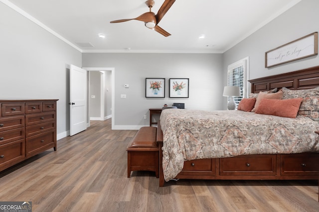 bedroom featuring baseboards, ornamental molding, recessed lighting, light wood-style flooring, and a ceiling fan