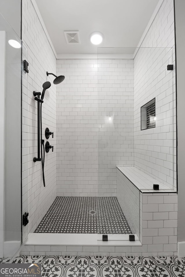 full bath featuring visible vents and a shower stall