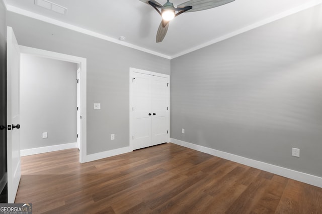 unfurnished bedroom with wood finished floors, visible vents, baseboards, ceiling fan, and a closet