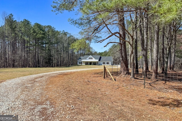 exterior space featuring a forest view