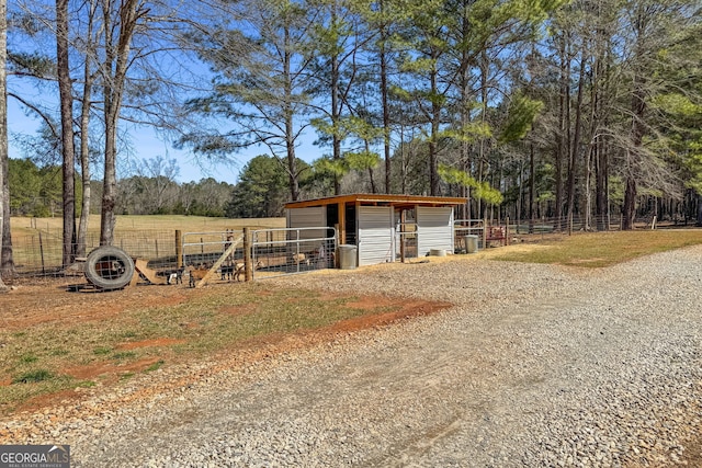 view of outbuilding featuring central air condition unit, an exterior structure, and an outdoor structure