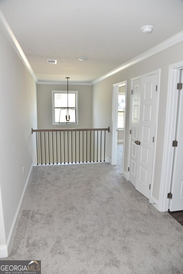 480 Brown Dove Ln, Grayson, GA 30017 - carpeted spare room featuring visible vents, baseboards, and ornamental molding