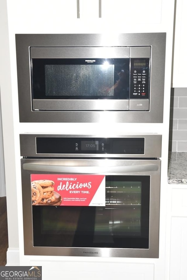 480 Brown Dove Ln, Grayson, GA 30017 - interior details featuring tasteful backsplash and stainless steel appliances