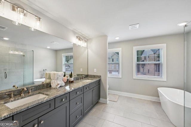 3119 Stonegate Dr SW, Atlanta, GA 30331 - full bath with a shower stall, a soaking tub, double vanity, and a sink