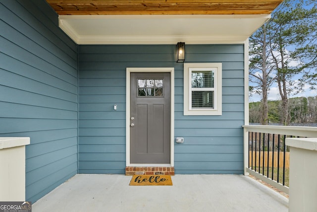 entrance to property featuring covered porch