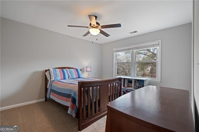 carpeted bedroom featuring a ceiling fan, baseboards, and visible vents