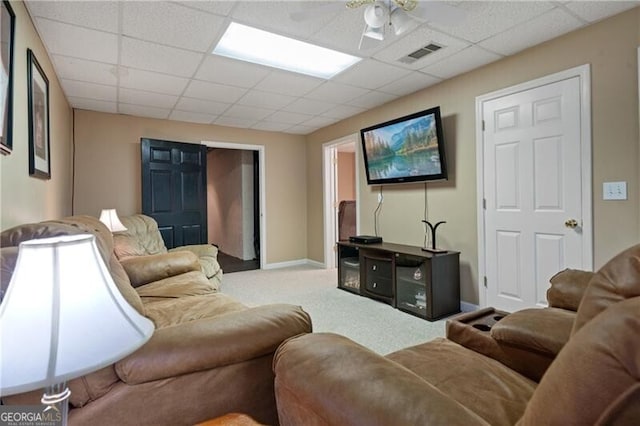 living room with visible vents, a ceiling fan, a paneled ceiling, and carpet