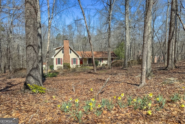 view of front of property featuring a chimney