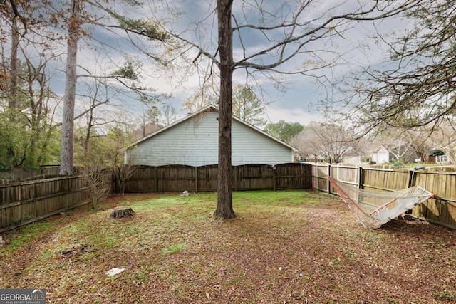 view of yard featuring a fenced backyard