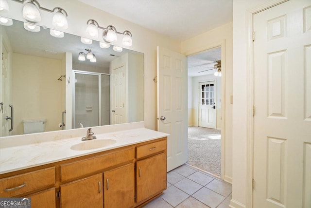 bathroom with vanity, tile patterned floors, a shower stall, and ceiling fan