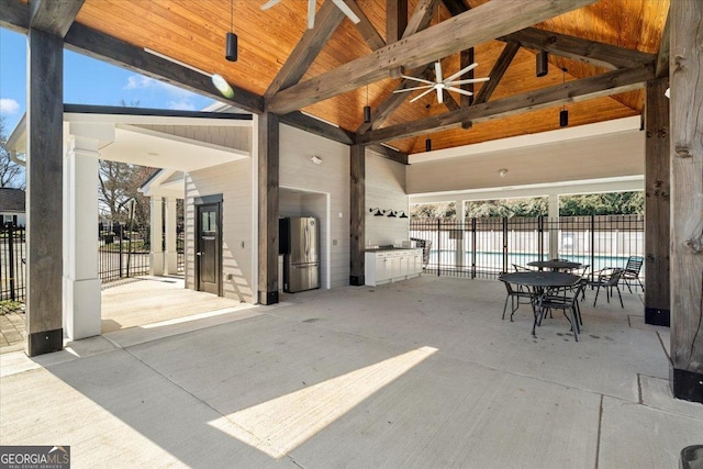 view of patio / terrace featuring a fenced in pool, a ceiling fan, and fence