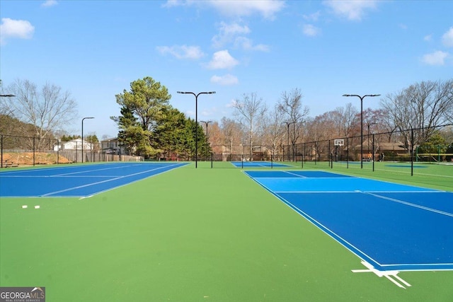 view of sport court with community basketball court and fence