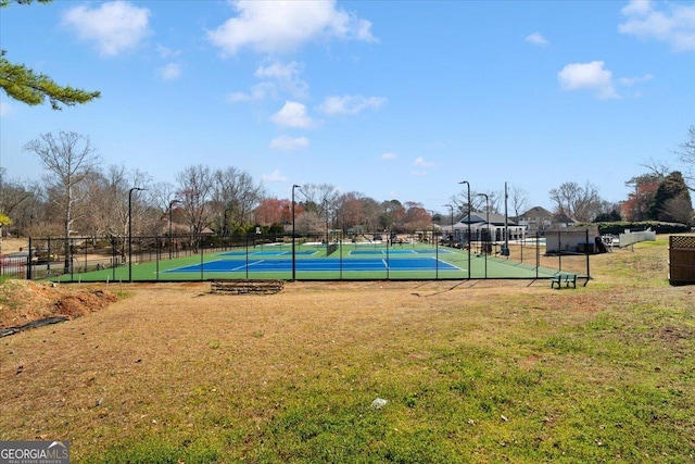 view of sport court featuring community basketball court, a yard, and fence