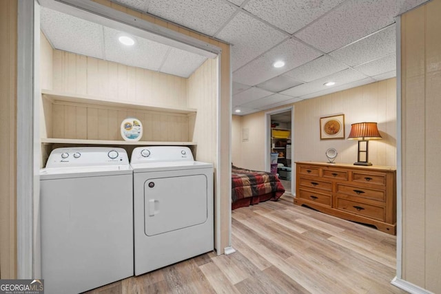 laundry area featuring laundry area, independent washer and dryer, and wood finished floors