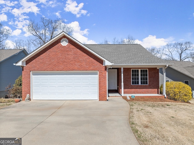 ranch-style house with brick siding, concrete driveway, a garage, and a shingled roof