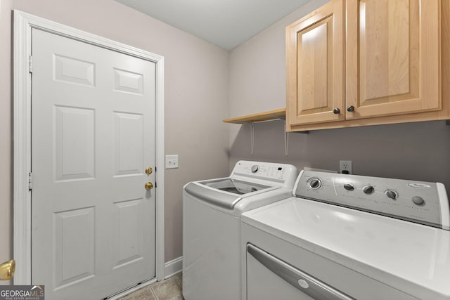 laundry room with washer and dryer, cabinet space, and light tile patterned floors