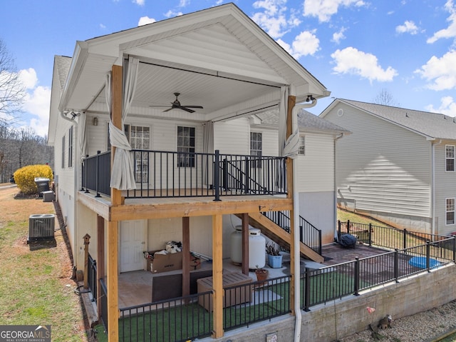 back of house featuring ceiling fan, fence, central air condition unit, stairway, and a patio