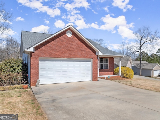 ranch-style home featuring a garage, brick siding, roof with shingles, and concrete driveway