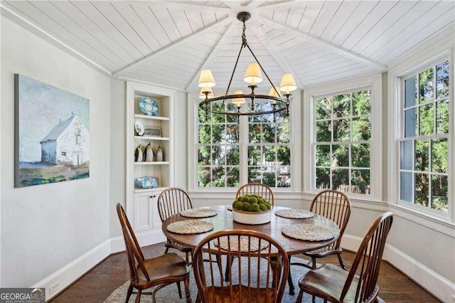 sunroom with a notable chandelier and wooden ceiling