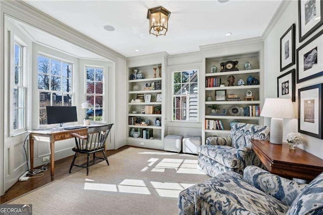 home office featuring crown molding, built in features, and baseboards