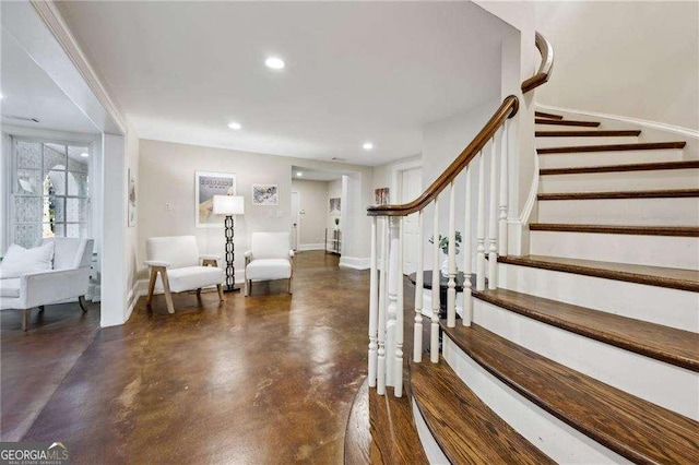 entryway featuring stairway, recessed lighting, concrete flooring, and baseboards