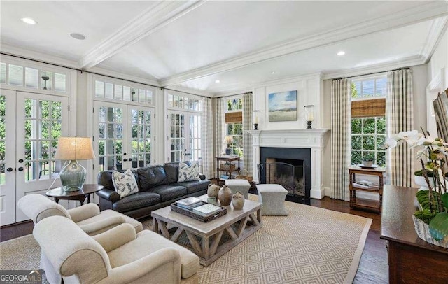 sunroom featuring beamed ceiling, a fireplace with flush hearth, and french doors