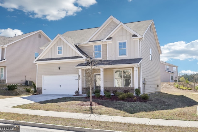7783 Hansel Ln, Lithonia, GA 30058 - craftsman inspired home with board and batten siding, driveway, a garage, cooling unit, and a front yard