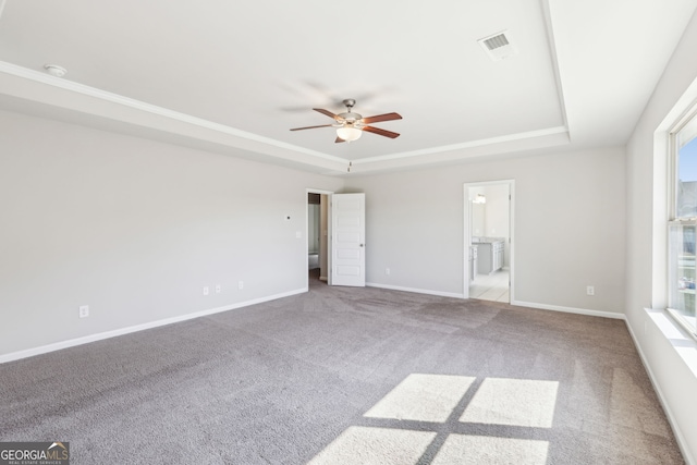 7783 Hansel Ln, Lithonia, GA 30058 - spare room featuring a tray ceiling, ceiling fan, and carpet flooring