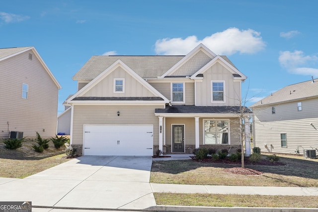 7783 Hansel Ln, Lithonia, GA 30058 - craftsman-style house with board and batten siding, driveway, stone siding, a garage, and covered porch