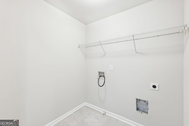 7783 Hansel Ln, Lithonia, GA 30058 - washroom featuring washer hookup, electric dryer hookup, baseboards, gas dryer hookup, and light tile patterned flooring