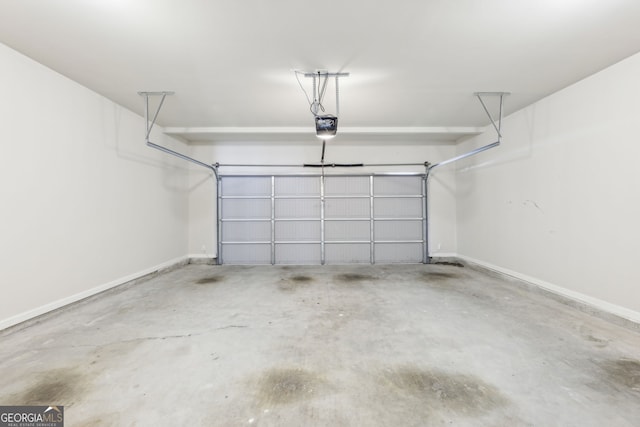 7783 Hansel Ln, Lithonia, GA 30058 - garage with baseboards and a garage door opener