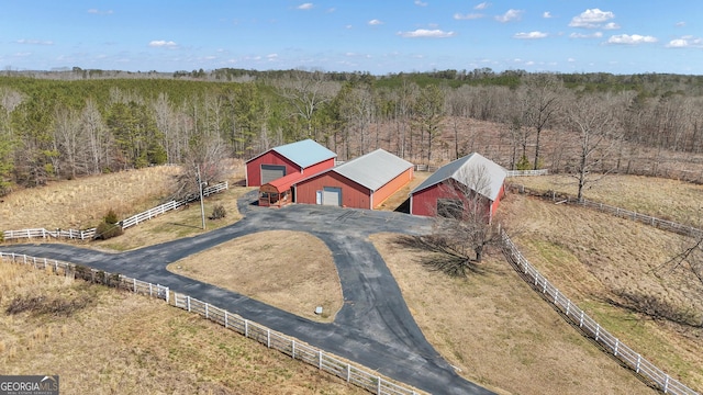 bird's eye view featuring a rural view and a forest view