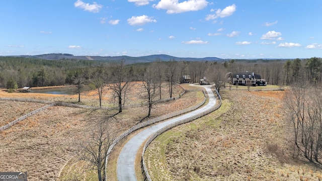 exterior space featuring a mountain view and a view of trees